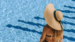 © Maksym - Summer sale. Young sexy woman in Sun hat, bikini swimsuit, sunglasses relaxing in blue pool water. Summer luxury vacation in spa resort pool.
