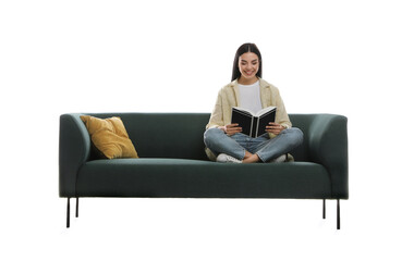 Wall Mural - Young woman reading book on comfortable green sofa against white background