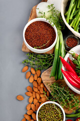 Wall Mural - Assorted vegetables and cereal on gray background. Healthy food concept.