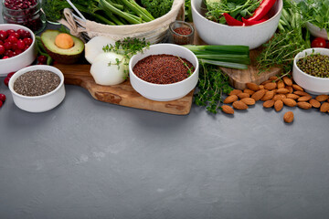 Wall Mural - Assorted vegetables and cereal on gray background. Healthy food concept.