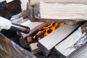 Fire made for barbeque with flame on wooden logs