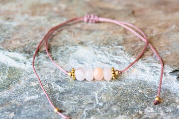 Wall Mural - Morganite cubic cut mineral stone bead bracelet on natural background