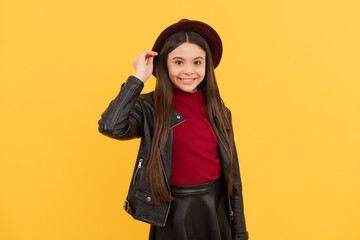 Canvas Print - cheerful stylish teen child. kid in hat on yellow background. autumn season trends.