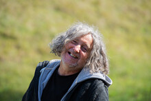 Portrait Of A Cheerful Senior Homeless Man