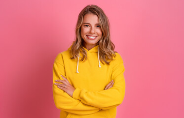 Wall Mural - young pretty blonde woman cute face expression posing in yellow hoodie