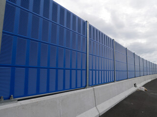 Wall Mural - SELANGOR, MALAYSIA - JULY 5, 2020: Noise barriers are installed along the vehicle lane bordering the residence to prevent noise pollution to the surrounding locals.
