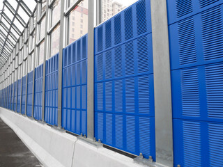 Wall Mural - SELANGOR, MALAYSIA - JULY 5, 2020: Noise barriers are installed along the vehicle lane bordering the residence to prevent noise pollution to the surrounding locals.
