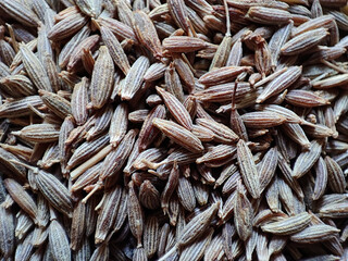 Sticker - Closeup of a stack of cumin seeds