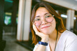 © Karlie Studio - Closeup of young Asian woman wears glasses with blur background.