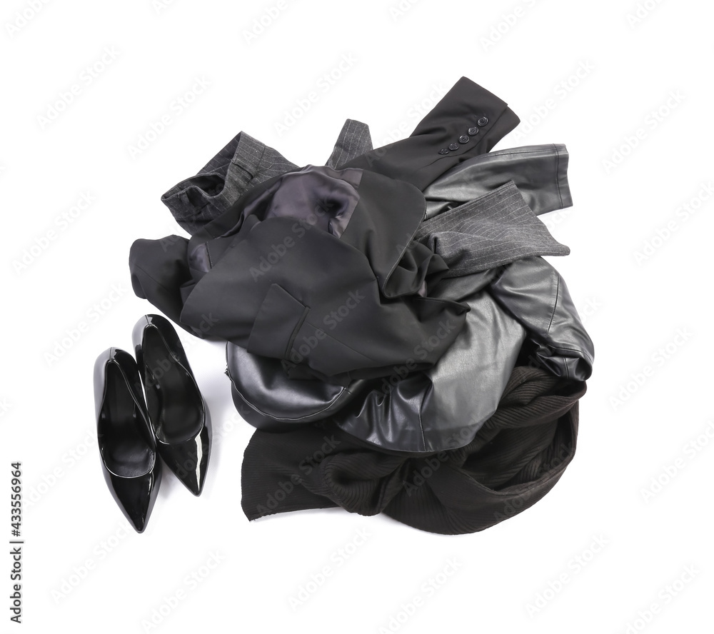 Heap of different clothes on white background