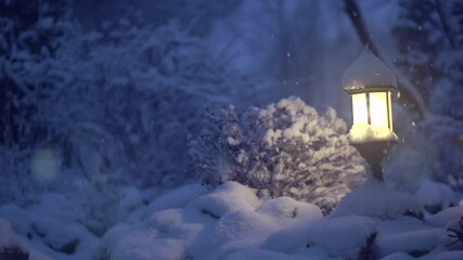 Sticker - Winter scene. Xmas Decoration with a lantern on snow in a winter garden. Christmas Background. Lamp at night. Garden design. Snowing. Slow motion video 240 fps