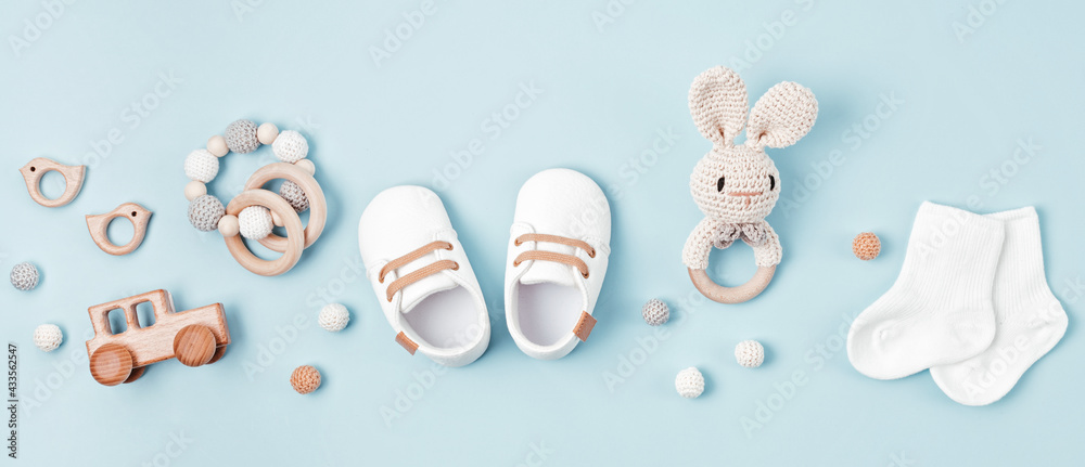 Baby shoes and teethers banner. Organic newborn accessories, branding, small business idea. - obrazy, fototapety, plakaty 
