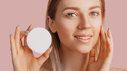 Wall Mural - girl make face beauty masks. anti-wrinkle cream for the freshness of the skin around the eyes. woman