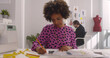 © TommyStockProject - Afro-american woman fashion designer in studio working on sketches