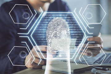 Double exposure of man's hands holding and using a digital device and fingerprint hologram drawing. Security concept.