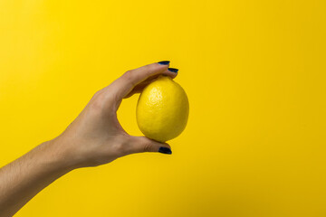 Poster - hand holding a lemon