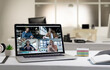 © vectorfusionart - Caucasian men and women having business video call on screen of laptop on desk