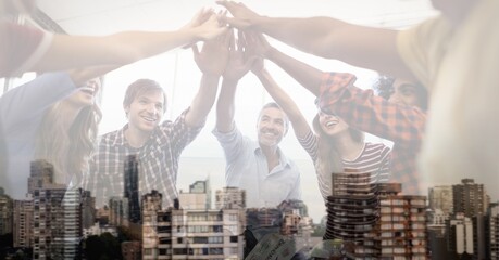 Canvas Print - Composition of group of diverse businesspeople teaming up over cityscape