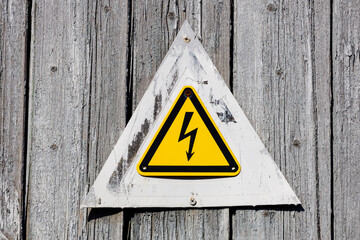 Poster - yellow triangle with lightning. warning sign about the danger of electric shock