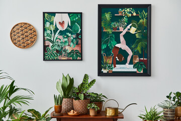 Wall Mural - Domestic interior of living room with vintage retro shelf, a lot of house plants, cacti, wooden mock up poster frame on the white wall and elegant accessories at stylish home garden. Template.