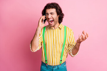 Photo of young arabian man scream shout smartphone mobile unhappy sad shocked news isolated over pastel color background