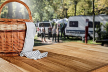 Wooden Table With Wicker Basket For Camping On A Sunny Holiday Day. 