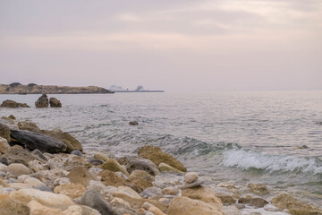 Wall Mural - Magical sunset background natural colours crashing wave Cyprus landscape beach sea stone . High quality photo