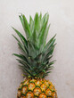© Cintia Viudez/ADDICTIVE STOCK - From above of ripe whole sweet pineapple placed on stone table in kitchen