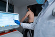© Enrique Espinosa/ADDICTIVE STOCK - Crop medic analyzing data on digital monitor during cardiac stress test of male patient walking on treadmill