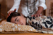© Enrique Espinosa/ADDICTIVE STOCK - Male spiritual therapist rubbing hands and touching relaxed female head with back during alternative therapy