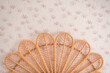 © Javier Bravo/ADDICTIVE STOCK - Comfortable cute natural vintage rattan headboard bed with ornamental cushions in a room