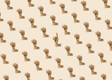 From Above Of Pattern Of Wooden Hands With Clenched Fists And One With Index Finger Pointing Up On Beige Background