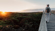 © Sergio Victor Vega/ADDICTIVE STOCK - Man with backpack and hat walking on a walkway looking the horizon