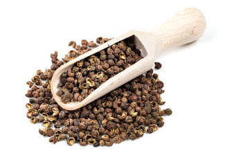 Wall Mural - wooden scoop on pile of sichuan pepper on white