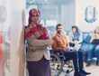 © .shock - Muslim woman wearing hijab in office, Arabic business woman covered with headscarf smiling. Successful Arab businesswoman in modern office.