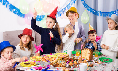 Wall Mural - children giving presents to little girl during party