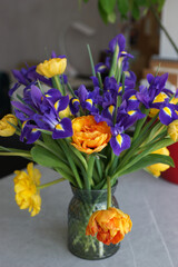 Lush bouquet with yellow tulips and irises