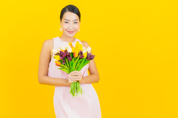 Portrait beautiful young asian woman smile with flower