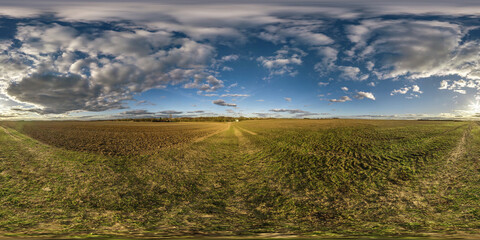 Wall Mural - full spherical hdri panorama 360 degrees angle view on among farming fields at evening with awesome sunset clouds in equirectangular projection, ready for VR AR virtual reality content