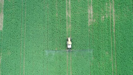 Sticker - Agriculture industry theme. Fertilizer in farm with tractor above top view