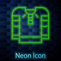 Poster - Glowing neon line Embroidered shirt icon isolated on brick wall background. National ukrainian clothing. Vector