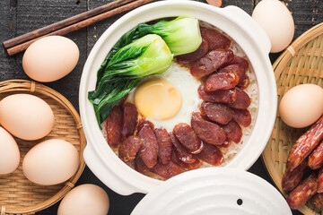 Cantonese style cooking of claypot rice with waxed meats