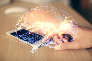 Double exposure of brain sketch hologram and woman holding and using a mobile device.