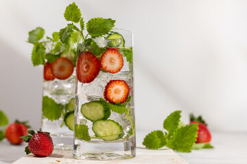 Wall Mural - Summer detox drink. Strawberry, mint and cucumber refreshing water.Infused detox water with berry, vegetable and herb. Ice cold summer lemonade.