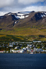 View of Akureyri, the country's second largest city, dwarfed by mountains across the Eyjafjörður fjord, north Iceland