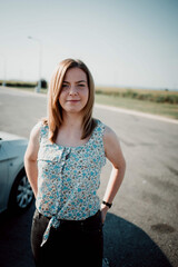 Sticker - Shallow focus shot of a Caucasian woman standing on the road