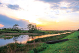 Fototapeta Natura - sunset in the swamp refecting in the river