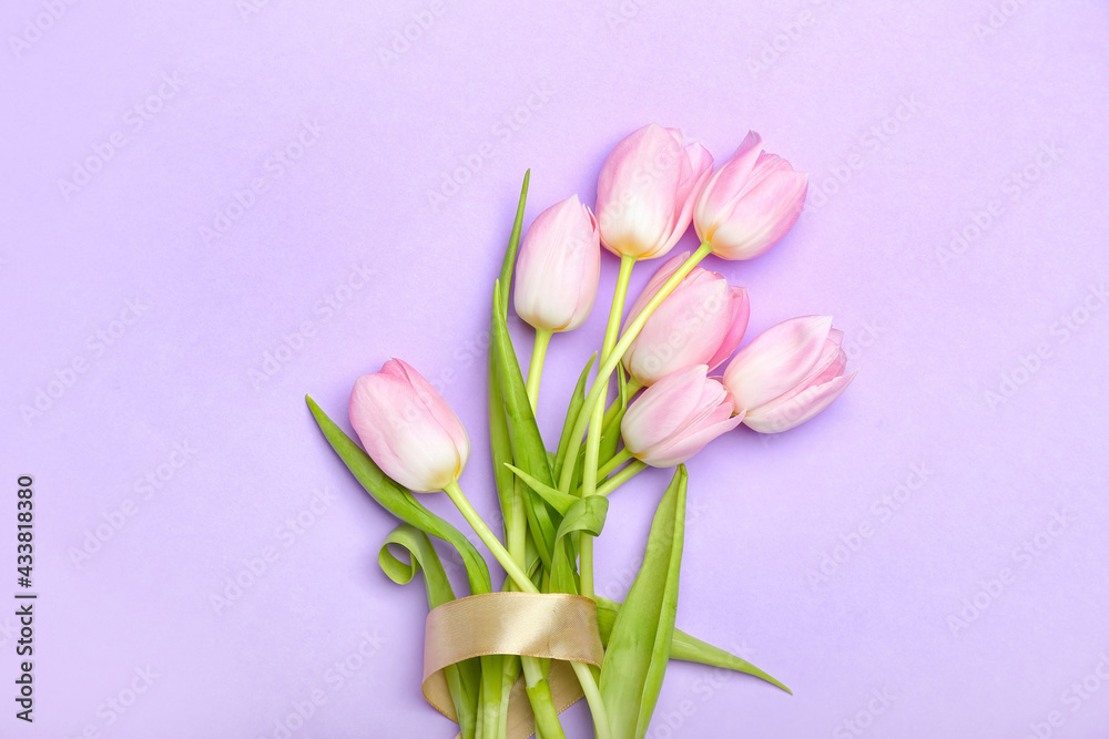 Beautiful tulip flowers on color background
