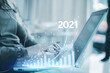 © Treecha - Business 2021, woman trading online via laptop. Stock market analysis concept. Successful revenue growth in the technology market