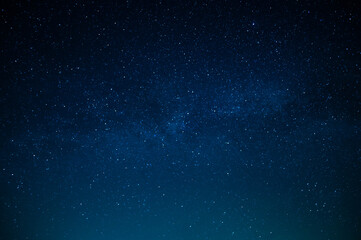 Wall Mural - beautiful night sky. twinkling stars. light clouds. silence and eternity. galaxy. deep blue tones. t